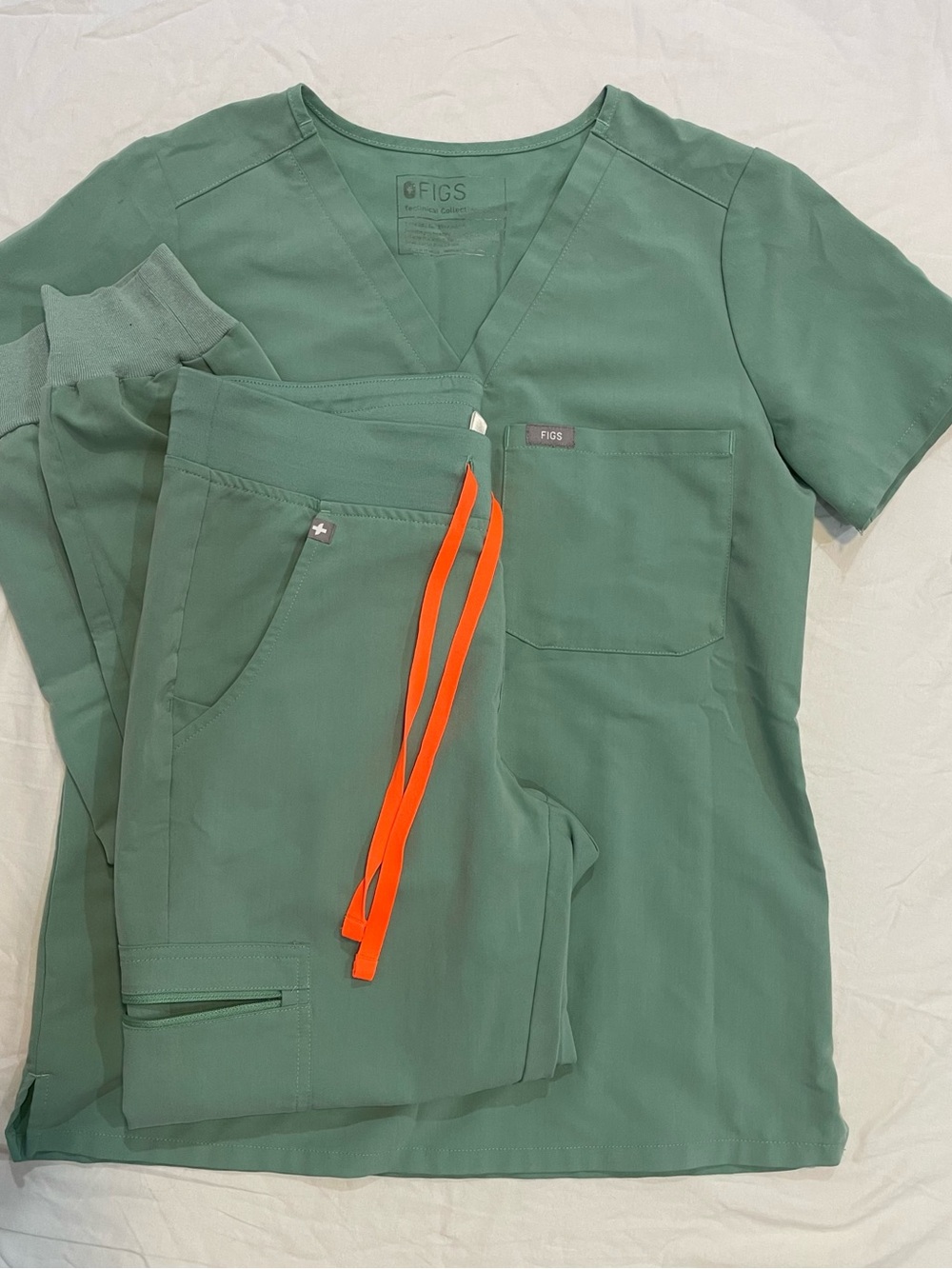 FIGS Women's Jogger Scrub Set in Jade Green with Orange Drawstring